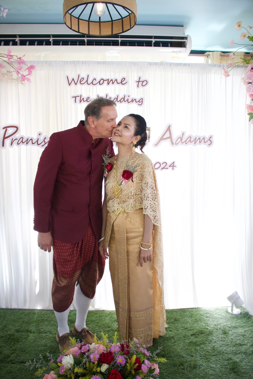 Ethan and Pranisa in traditional Thai wedding attire